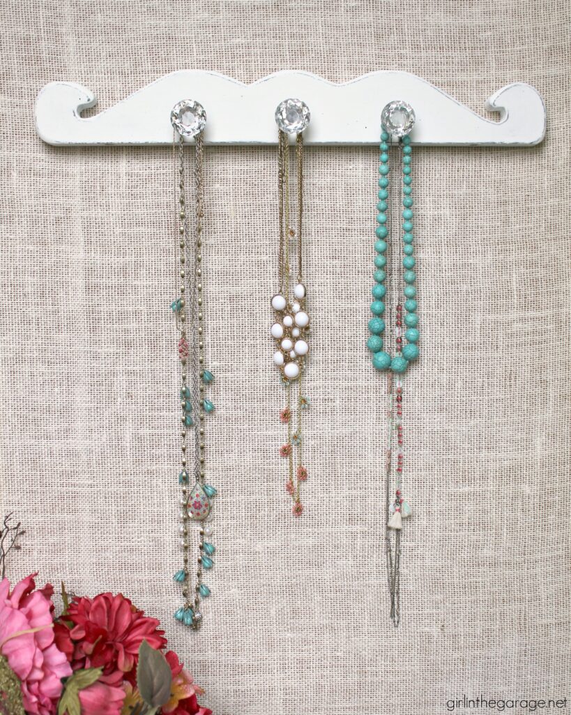 How to create an easy, stunning DIY necklace display with salvaged wood to organize your treasured jewelry. By Girl in the Garage