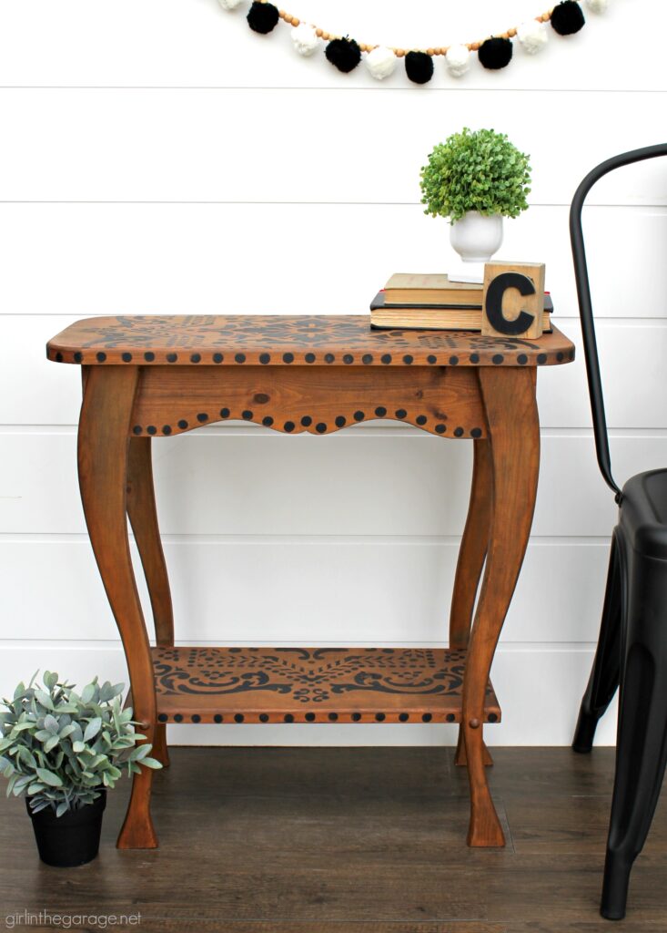 Love the black wood stain look? Learn how to stencil a table and easily stain wood black with furniture wax. By Girl in the Garage