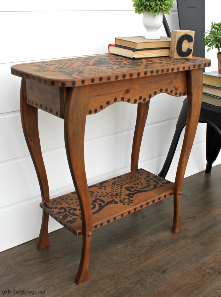 Love the black wood stain look? Learn how to stencil a table and easily stain wood black with furniture wax. By Girl in the Garage