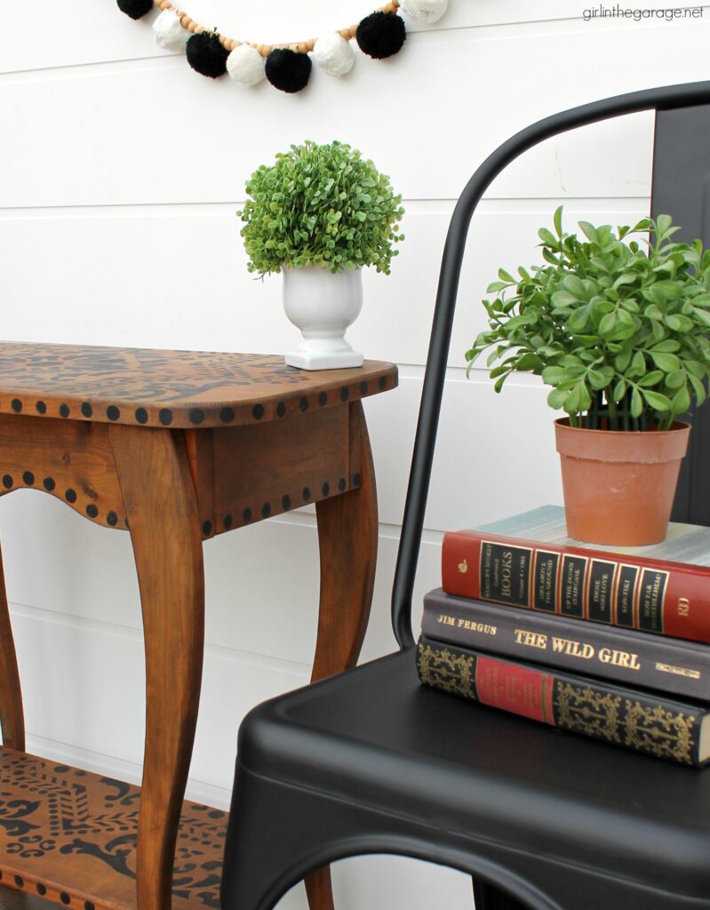 Love the black wood stain look? Learn how to stencil a table and easily stain wood black with furniture wax. By Girl in the Garage