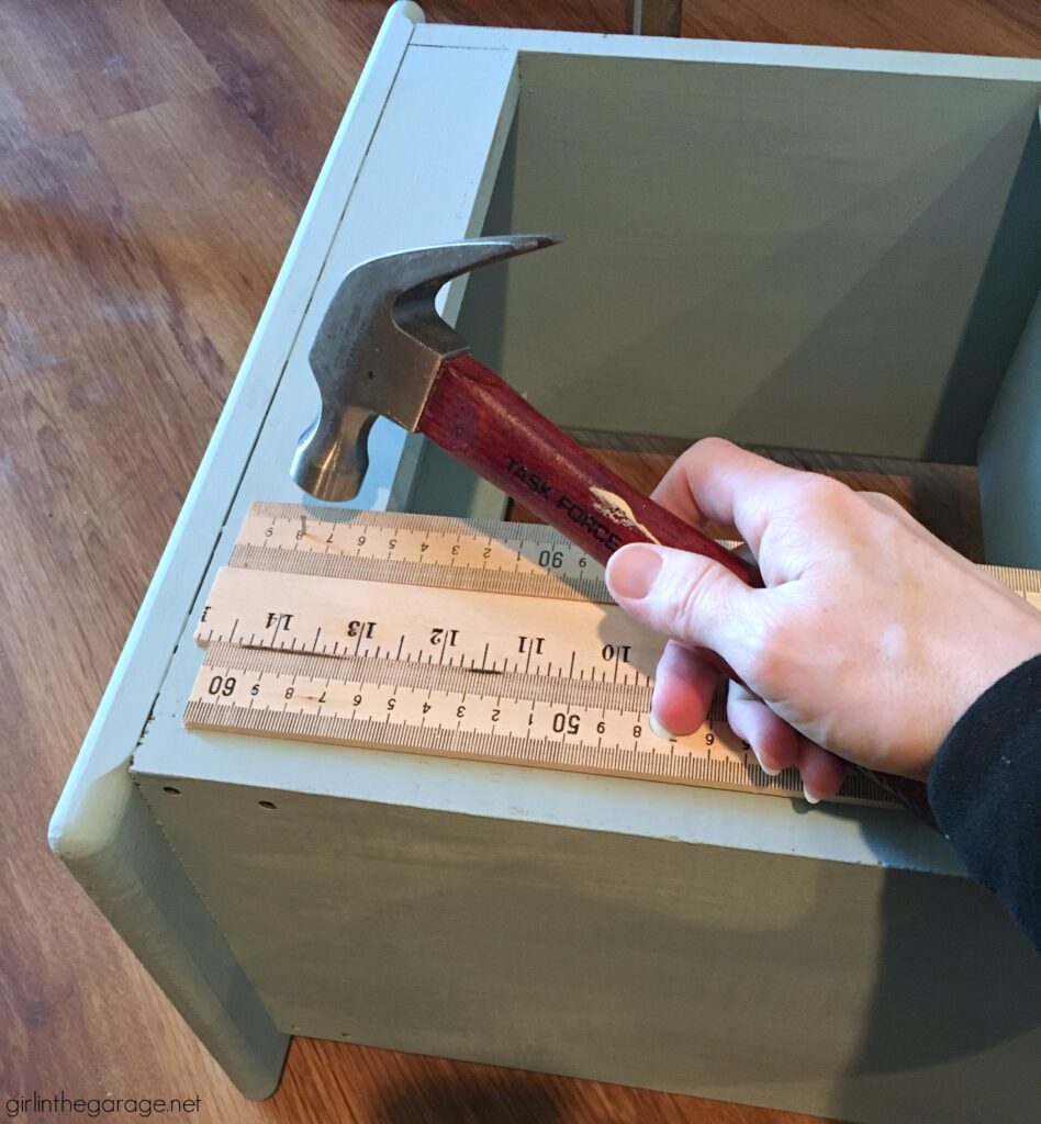 Give an old bookcase pizzazz with Chalk Paint and repurposed yardsticks. This easy painted furniture makeover idea oozes vintage charm. By Girl in the Garage