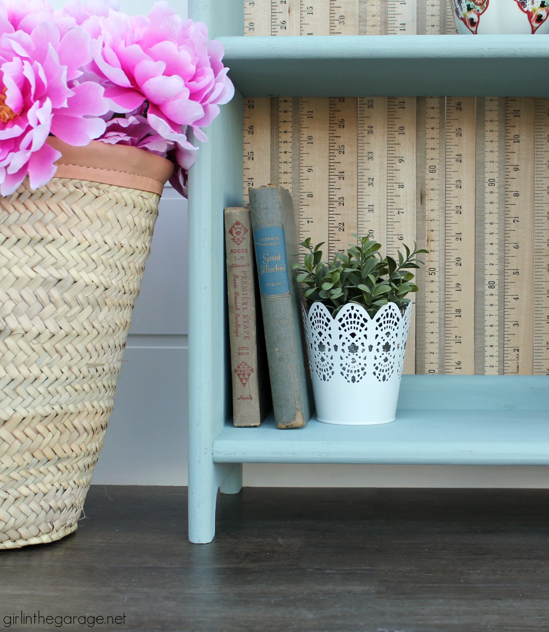 Give an old bookcase pizzazz with Chalk Paint and repurposed yardsticks. This easy painted furniture makeover idea oozes vintage charm. By Girl in the Garage