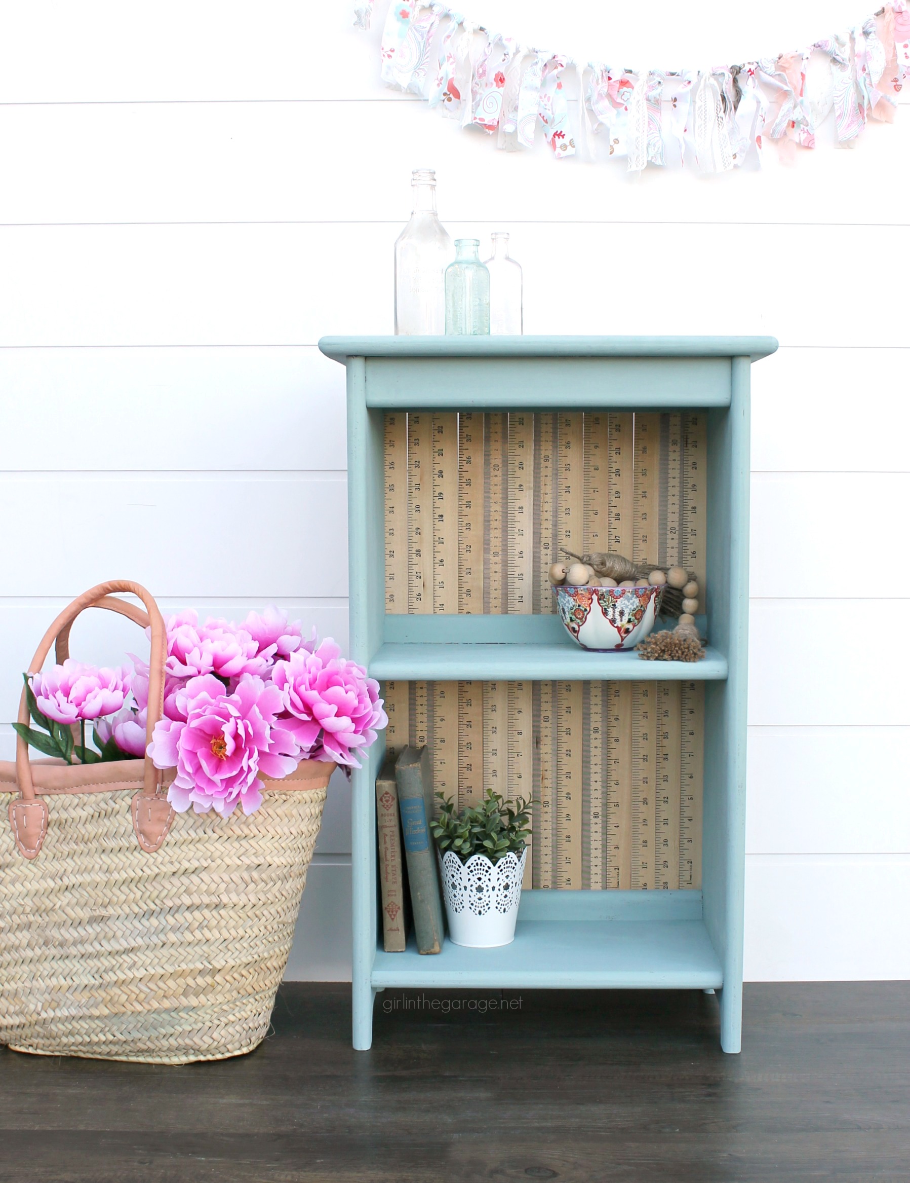 Give an old bookcase pizzazz with Chalk Paint and repurposed yardsticks. This easy painted furniture makeover idea oozes vintage charm. By Girl in the Garage