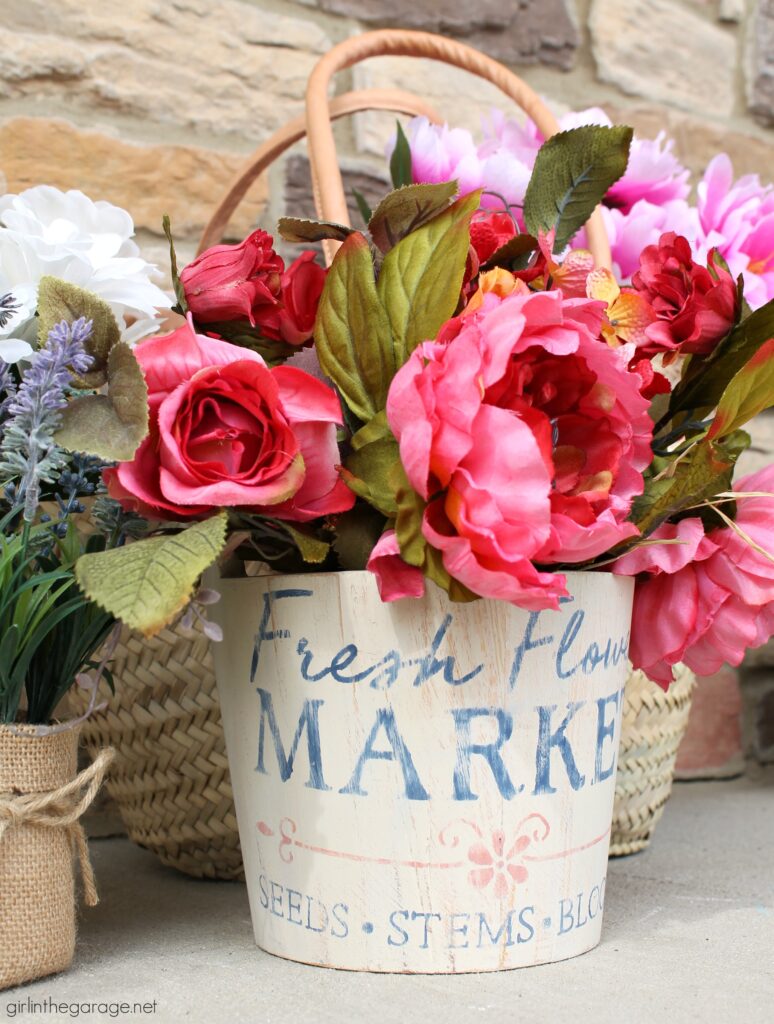 Create a gorgeous home for your flowers with this stenciled wooden flower bucket project. It's easy and beautiful decor. DIY home decor ideas by Girl in the Garage