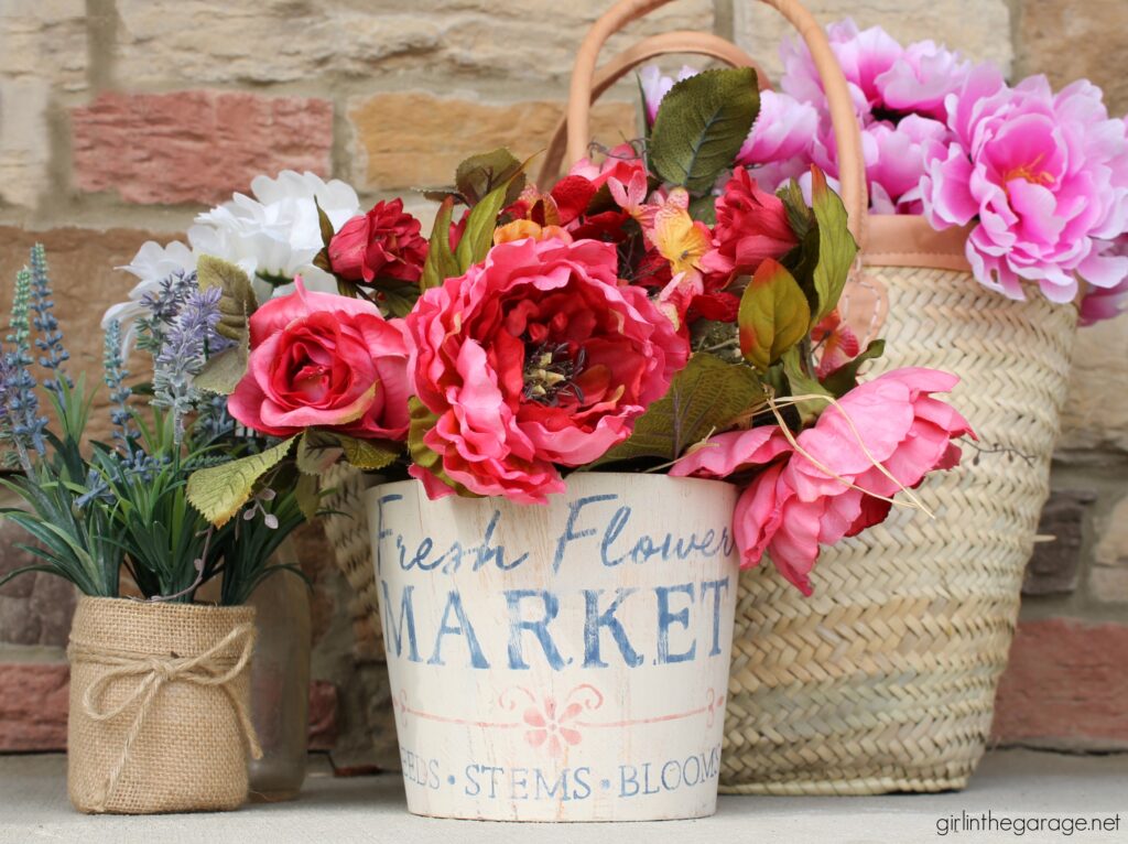 Create a gorgeous home for your flowers with this stenciled wooden flower bucket project. It's easy and beautiful decor. DIY home decor ideas by Girl in the Garage