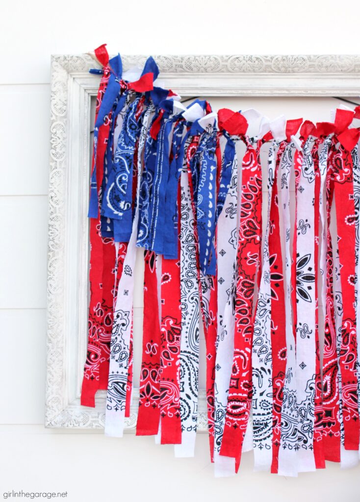 Make this festive DIY rag flag with bandanas for your 4th of July decor. Celebrate the summer with amazing DIY patriotic home decor ideas. By Girl in the Garage