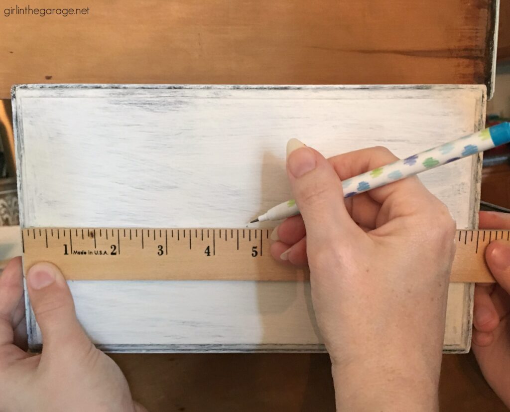 How to measure and drill new holes for drawer hardware. DIY painted furniture ideas by Girl in the Garage
