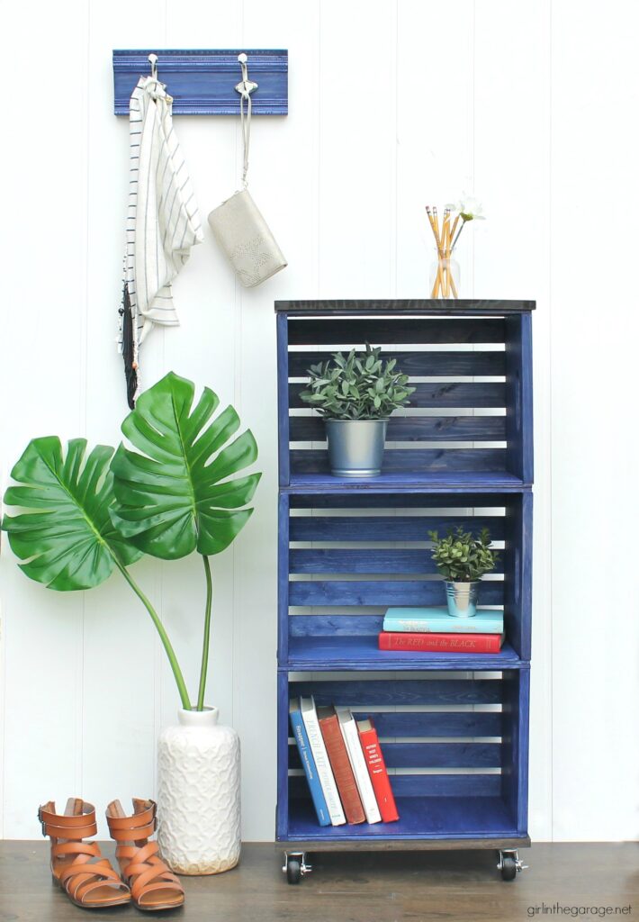 How to build a wooden crate bookshelf and properly prepare, stain, and protect it with Minwax products. DIY makeover ideas by Girl in the Garage. #ad