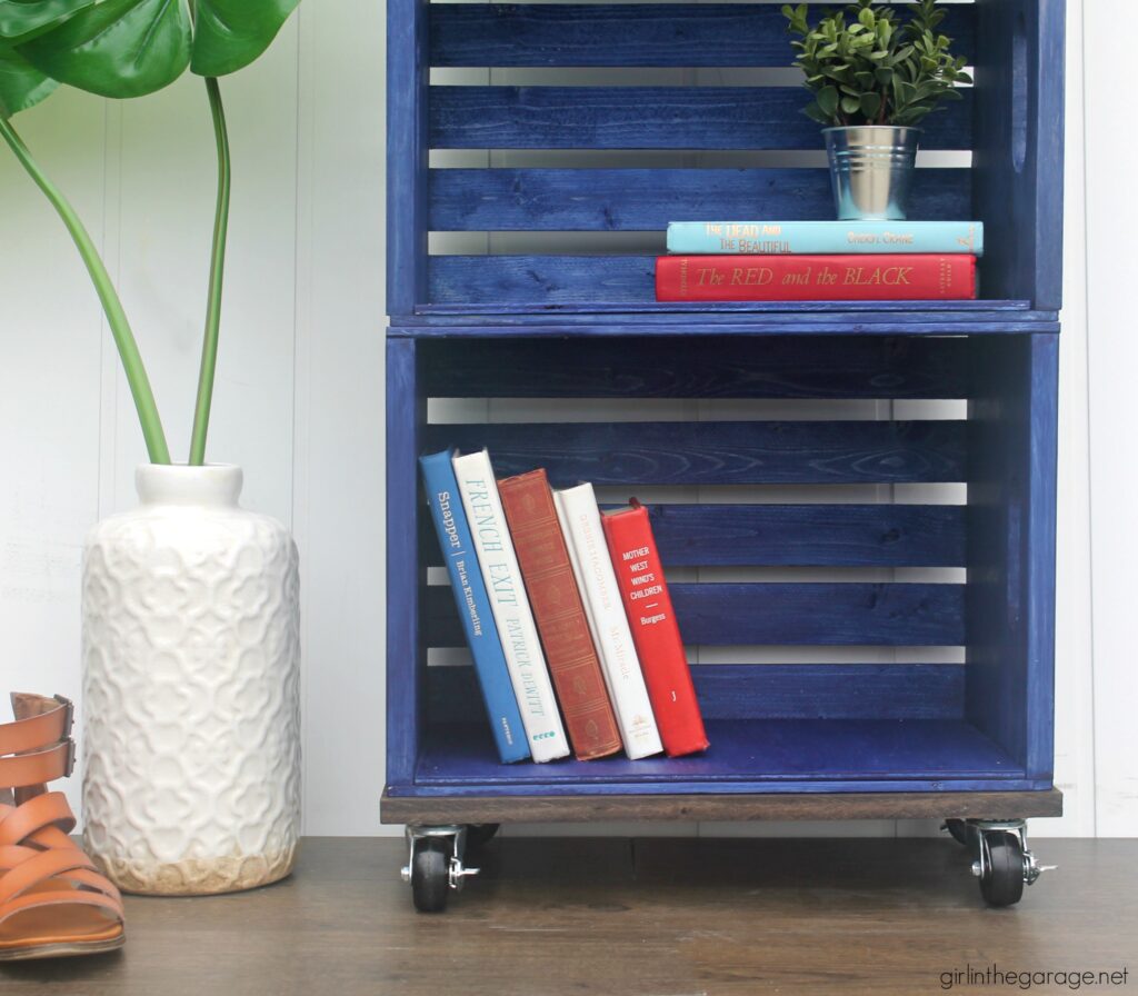 How to build a wooden crate bookshelf and properly prepare, stain, and protect it with Minwax products. DIY makeover ideas by Girl in the Garage. #ad