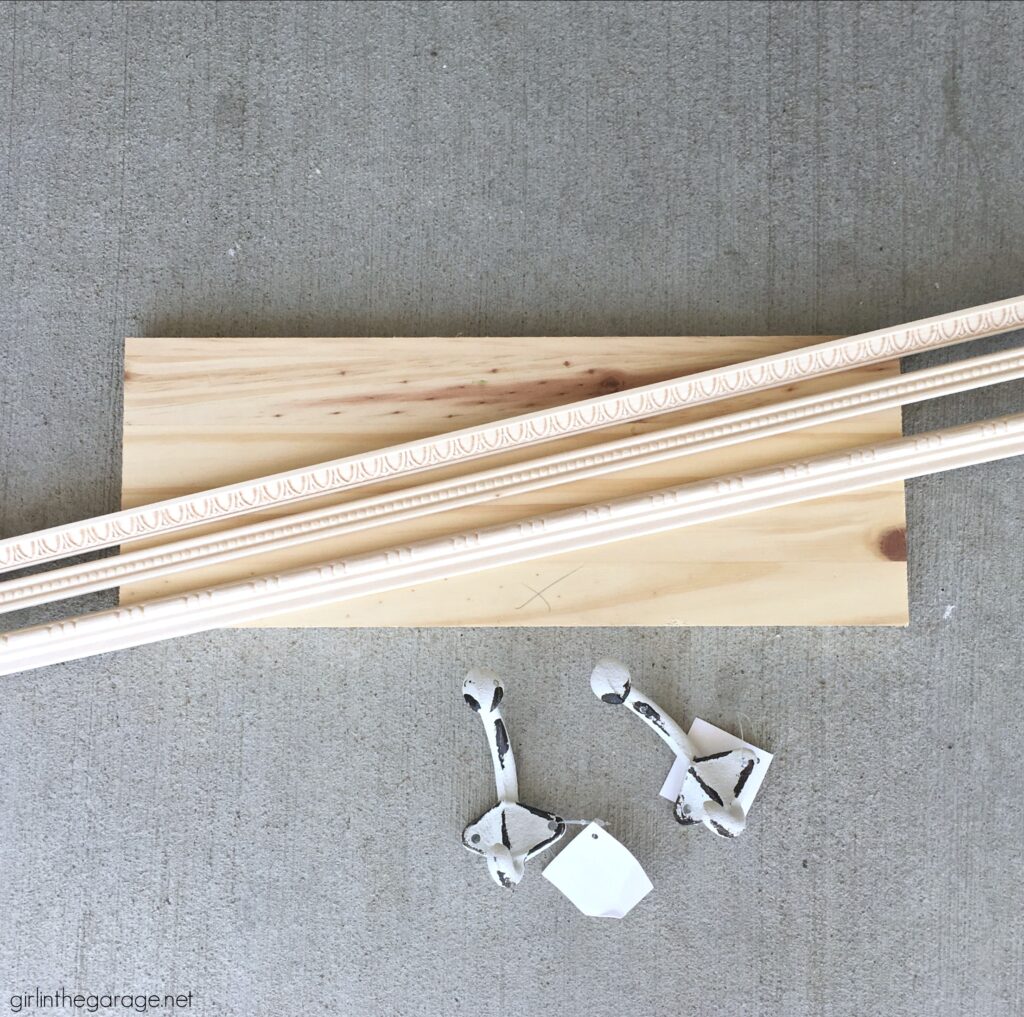 How to make a hanging coat rack with decorative trim and properly prepare, stain, and protect it with Minwax products. DIY makeover ideas by Girl in the Garage. #ad