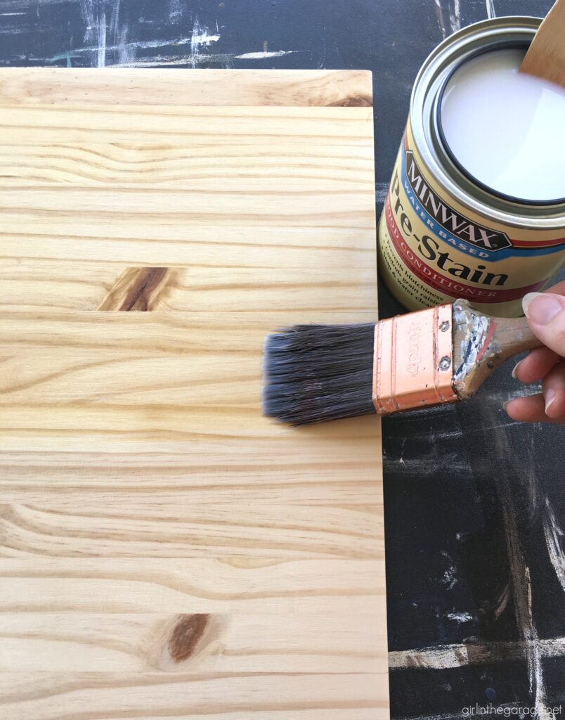 How to build a wooden crate bookshelf and properly prepare, stain, and protect it with Minwax products. DIY makeover ideas by Girl in the Garage. #ad