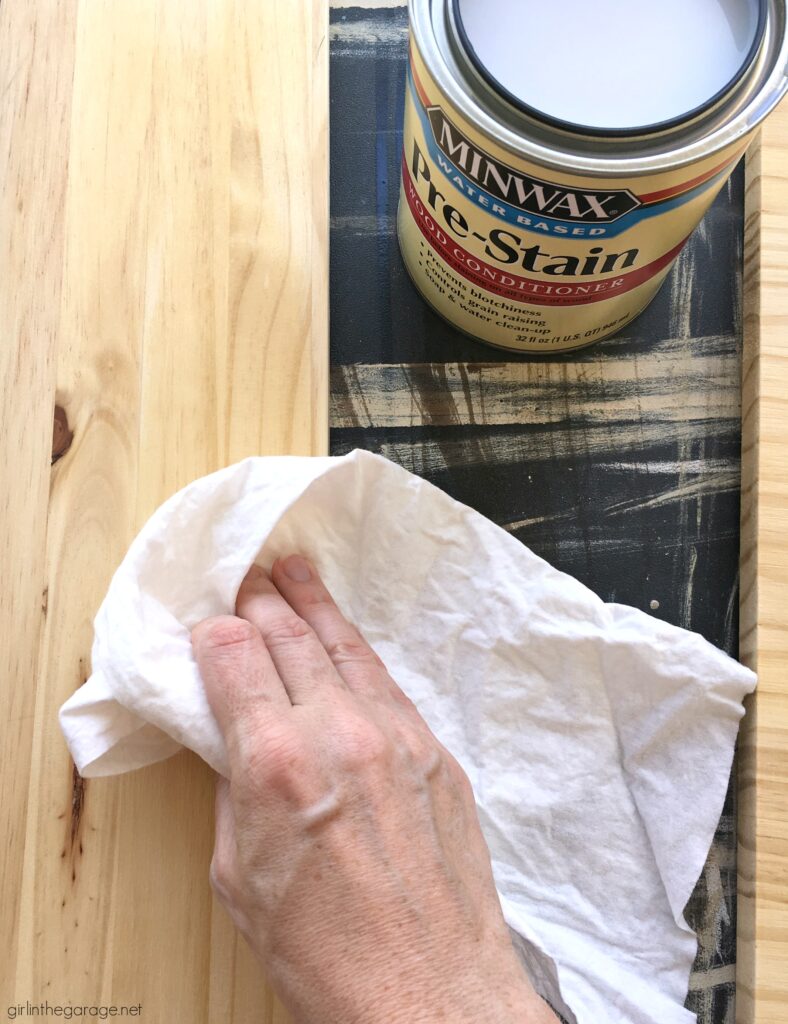 How to build a wooden crate bookshelf and properly prepare, stain, and protect it with Minwax products. DIY makeover ideas by Girl in the Garage. #ad