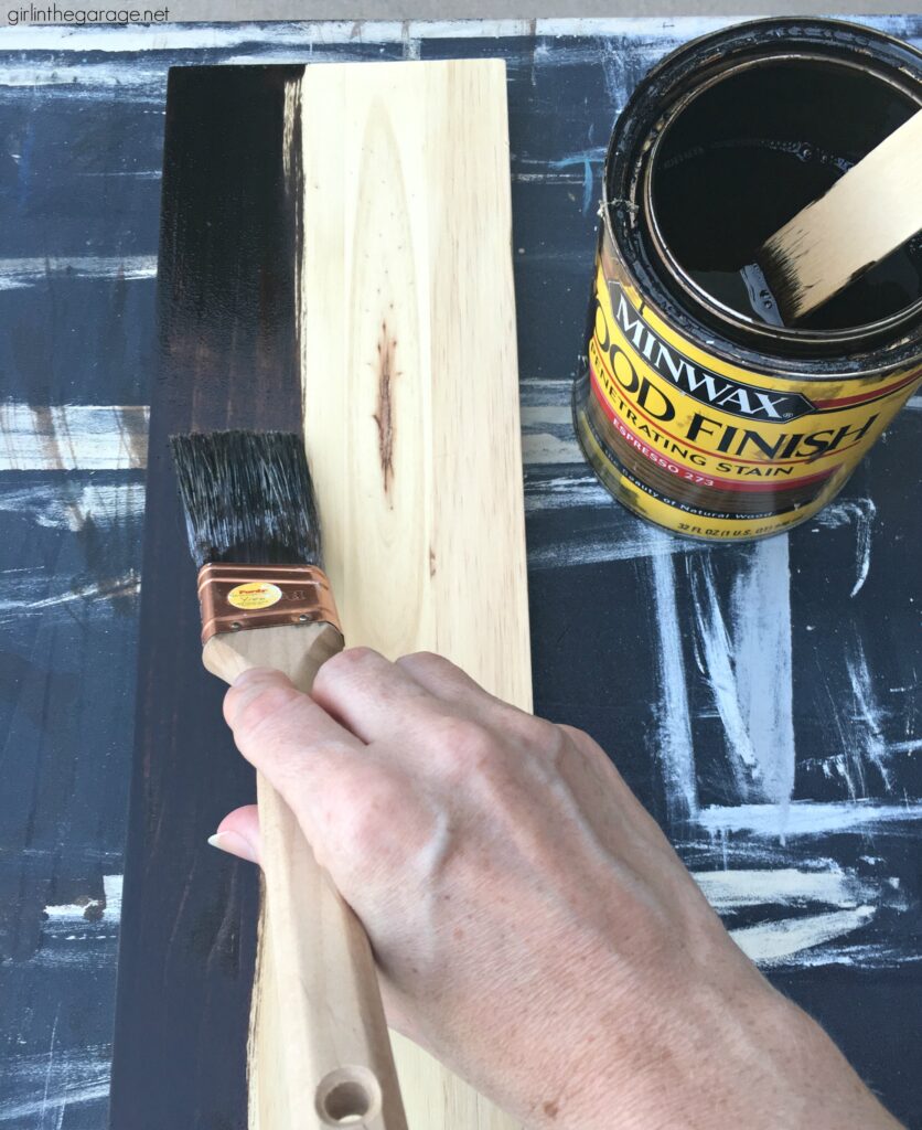 How to build a wooden crate bookshelf and properly prepare, stain, and protect it with Minwax products. DIY makeover ideas by Girl in the Garage. #ad