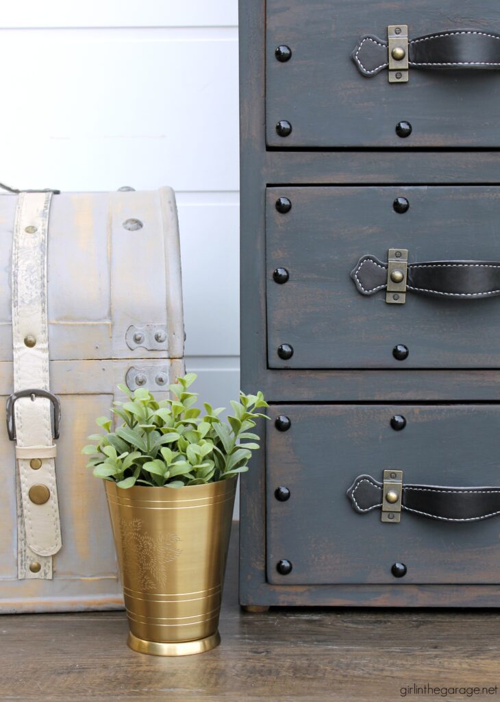 Create an antique steamer trunk with Chalk Paint and decorative accessories - this painted trunk nightstand is stunning industrial decor. By Girl in the Garage