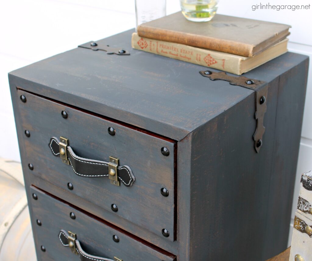 Create an antique steamer trunk with Chalk Paint and decorative accessories - this painted trunk nightstand is stunning industrial decor. By Girl in the Garage