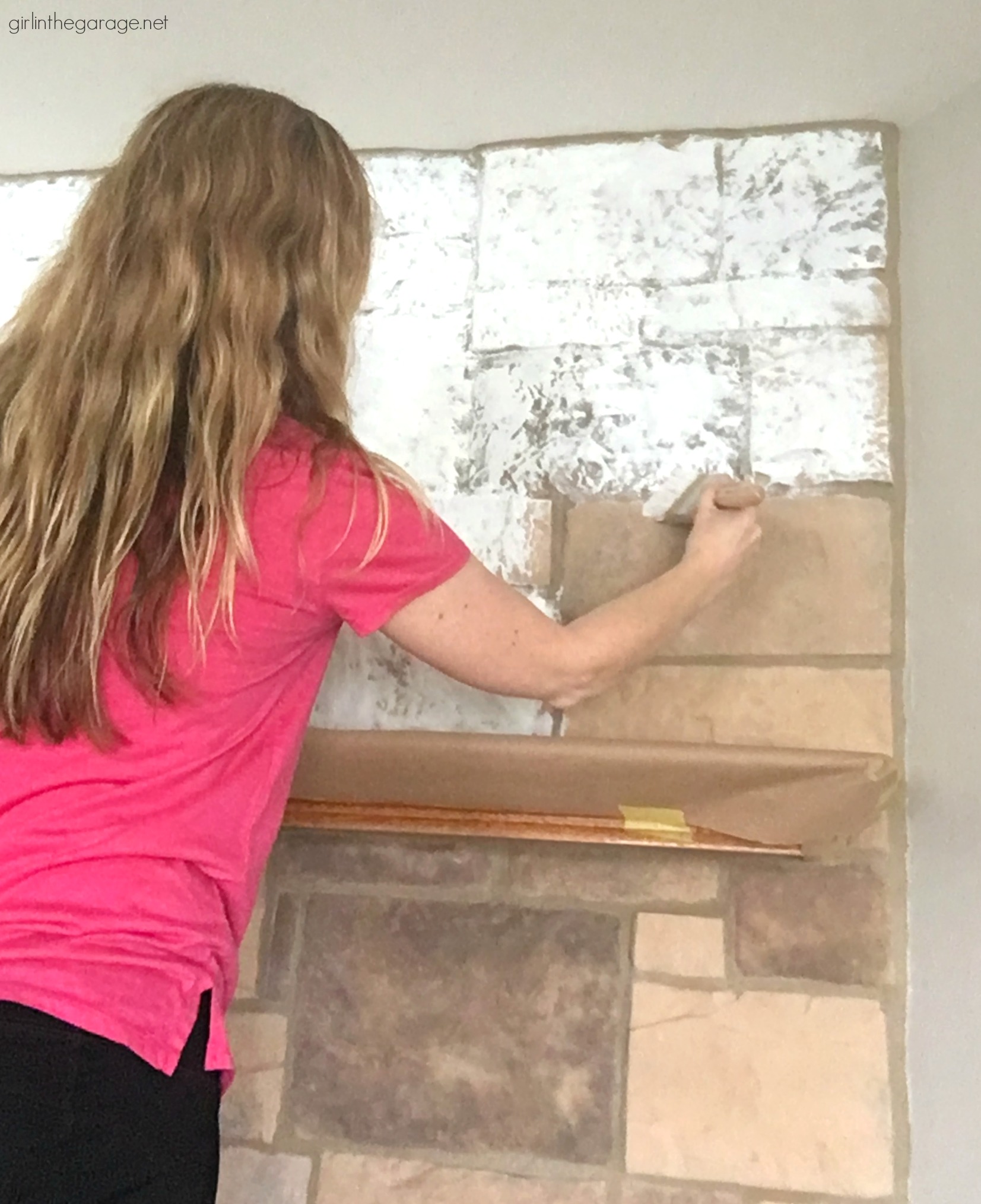 How to easily paint a stone fireplace white with helpful Purdy products meant for rough surfaces. #ad DIY makeover ideas by Girl in the Garage