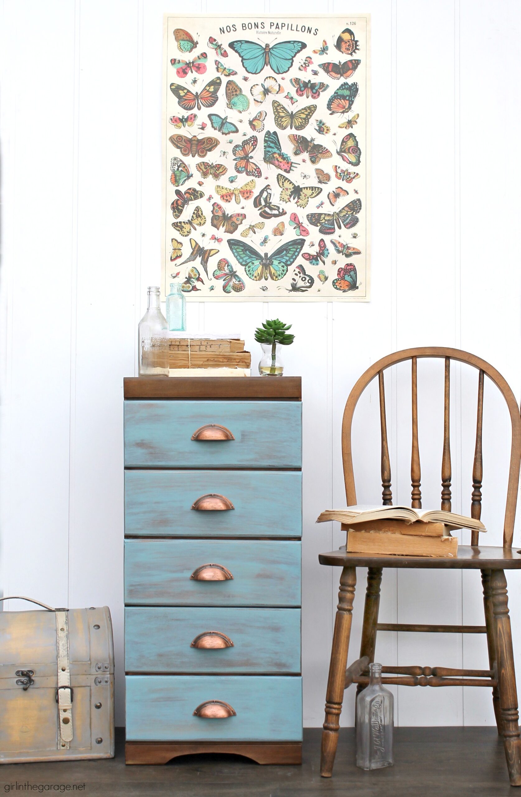 Learn how to refinish a dresser with Minwax products including Vintage Blue, the 2021 Color of the Year. Add faux-aged copper pulls and map paper lined drawers for the finishing touch. #ad DIY makeover ideas by Girl in the Garage