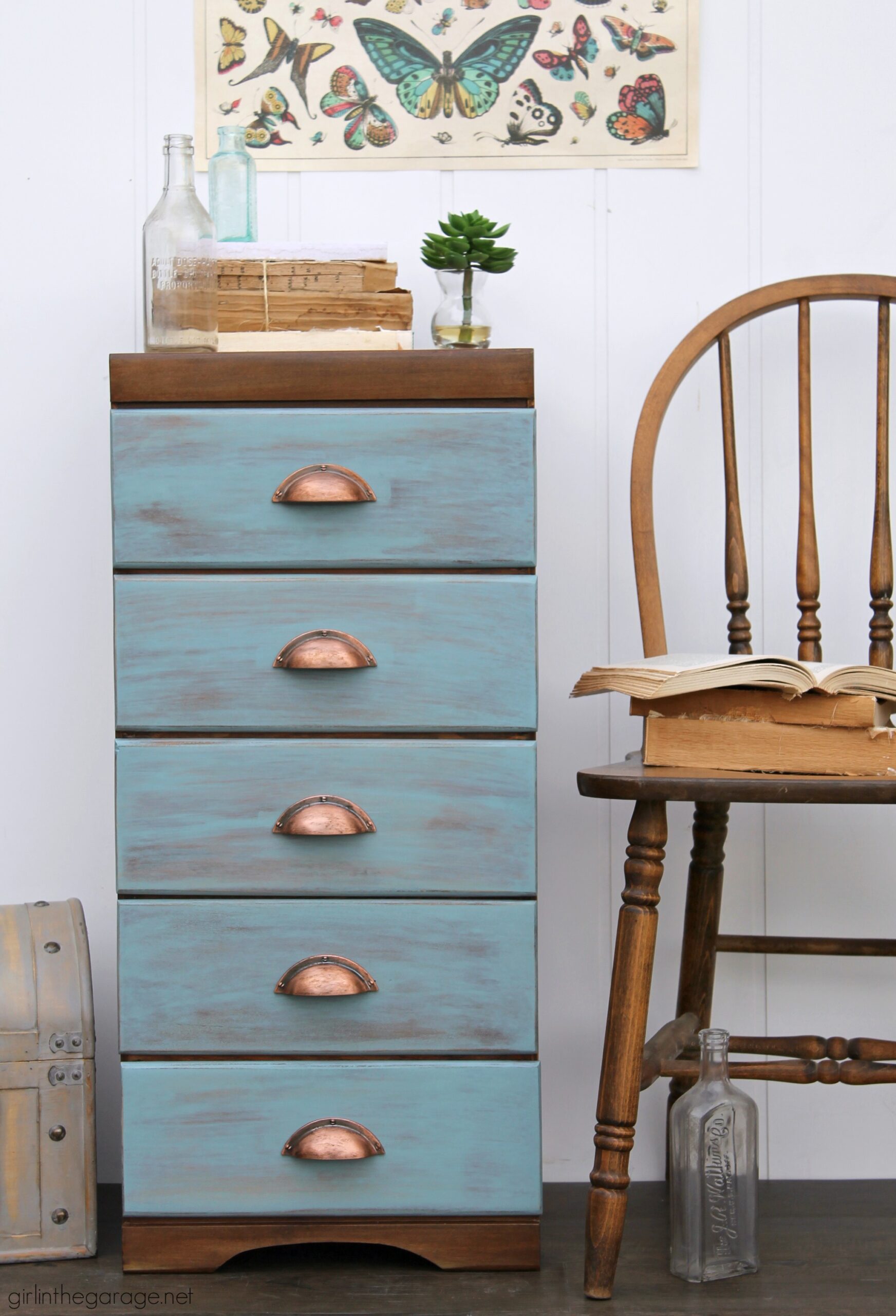 Learn how to refinish a dresser with Minwax products including Vintage Blue, the 2021 Color of the Year. Add faux-aged copper pulls and map paper lined drawers for the finishing touch. #ad DIY makeover ideas by Girl in the Garage