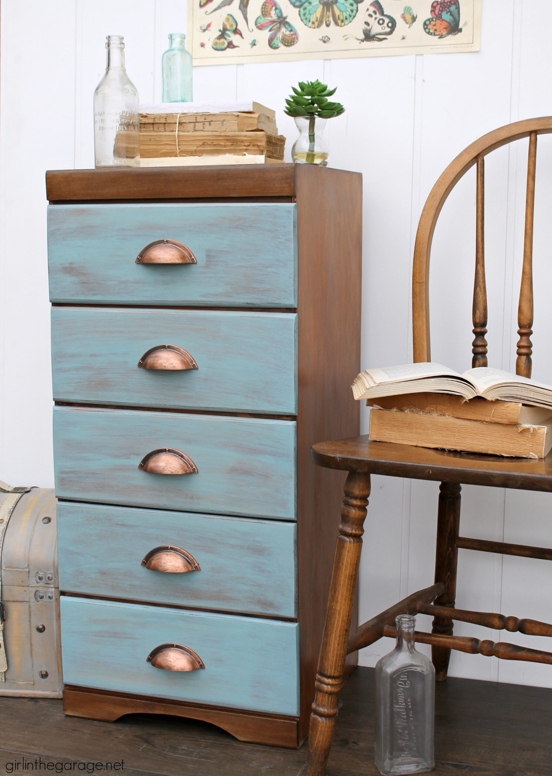 Learn how to refinish a dresser with Minwax products including Vintage Blue, the 2021 Color of the Year. Add faux-aged copper pulls and map paper lined drawers for the finishing touch. #ad DIY makeover ideas by Girl in the Garage