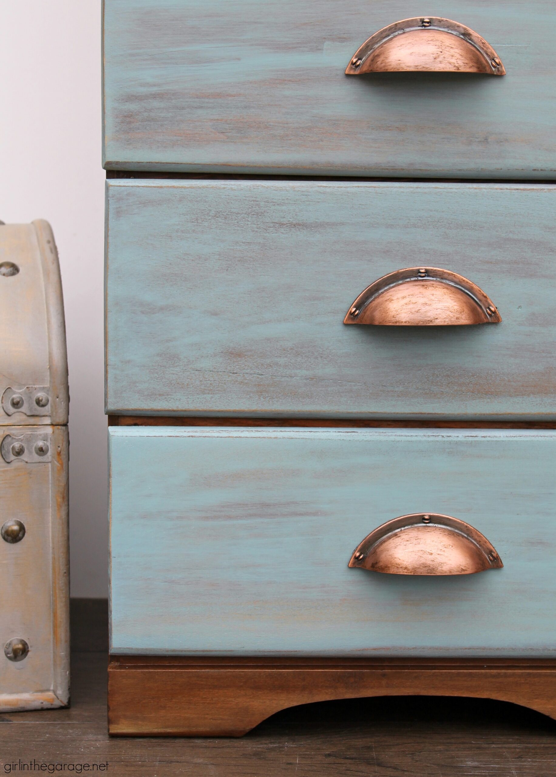 Learn how to refinish a dresser with Minwax products including Vintage Blue, the 2021 Color of the Year. Add faux-aged copper pulls and map paper lined drawers for the finishing touch. #ad DIY makeover ideas by Girl in the Garage