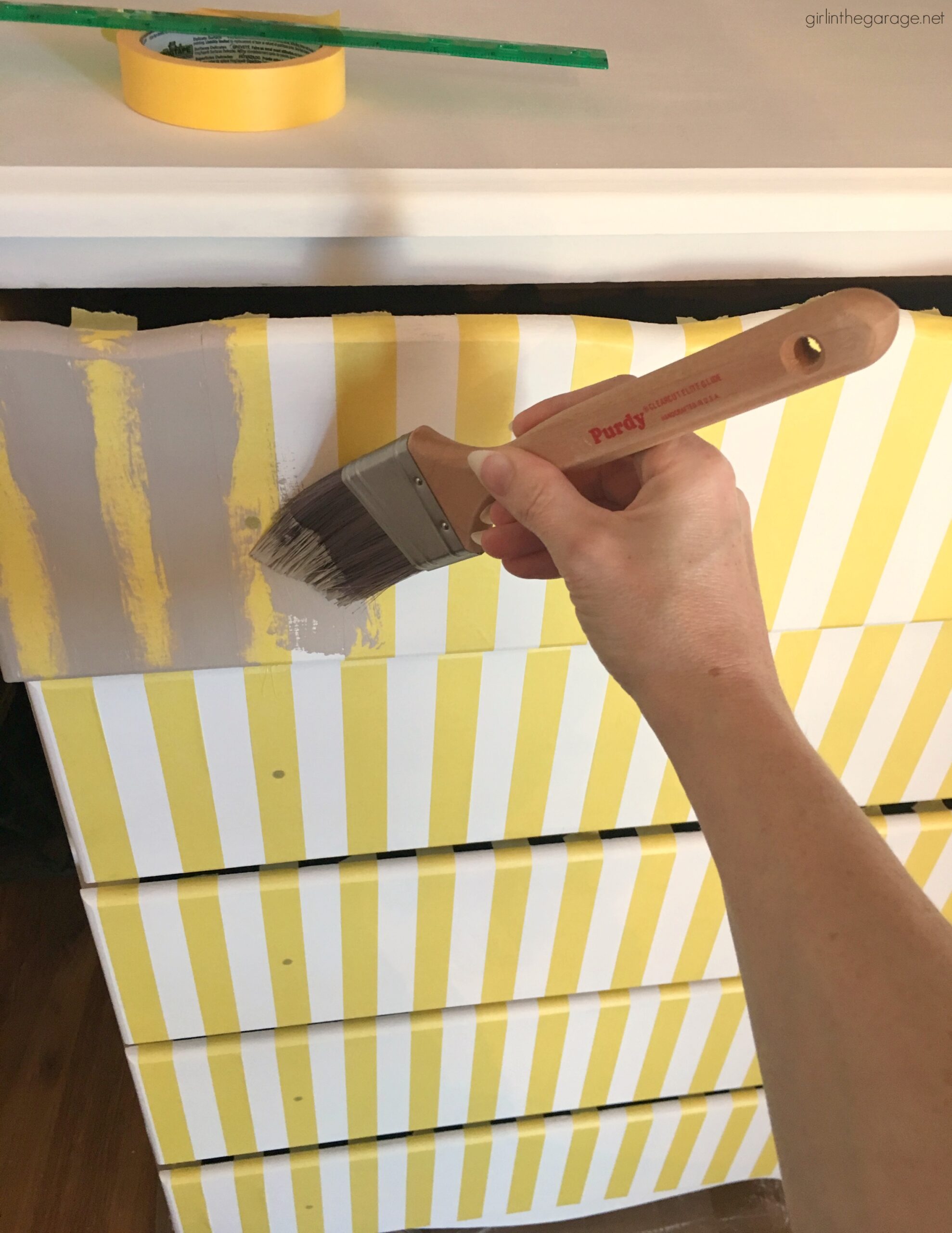 Give old furniture lots of charm with painted stripes and numbers. Learn how to easily paint stripes on a dresser with tape and a high quality Purdy paint brush. #ad DIY painted furniture ideas by Girl in the Garage