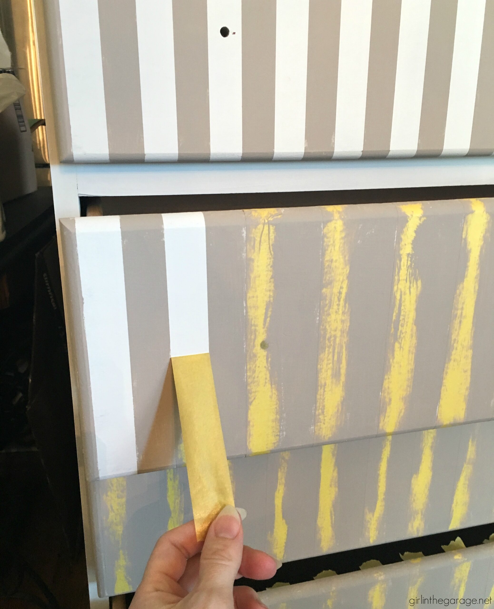 Give old furniture lots of charm with painted stripes and numbers. Learn how to easily paint stripes on a dresser with tape and a high quality Purdy paint brush. #ad DIY painted furniture ideas by Girl in the Garage