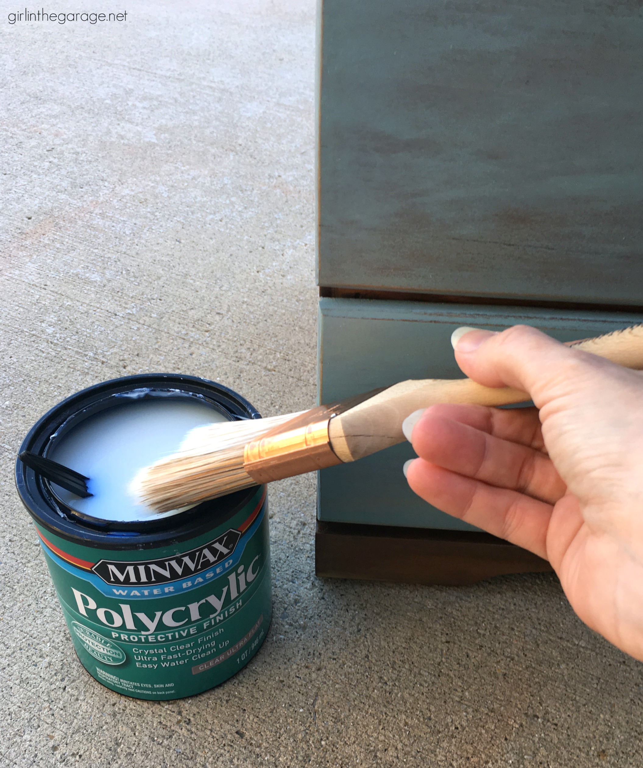 Learn how to refinish a dresser with Minwax products including Vintage Blue, the 2021 Color of the Year. Add faux-aged copper pulls and map paper lined drawers for the finishing touch. #ad DIY makeover ideas by Girl in the Garage