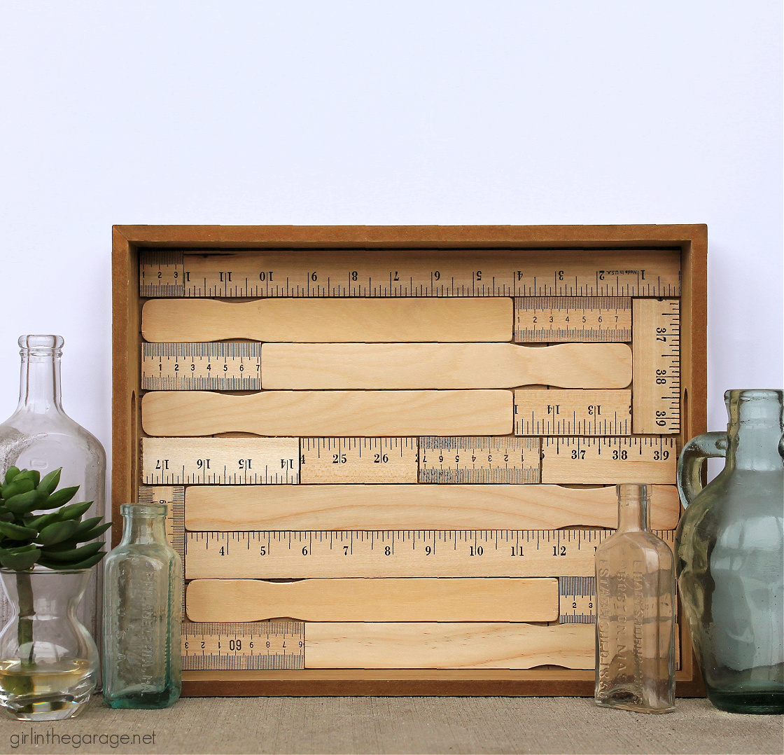 How to make an adorable upcycled wood tray with yardsticks and paint stirrers. Easy DIY home decor idea by Girl in the Garage