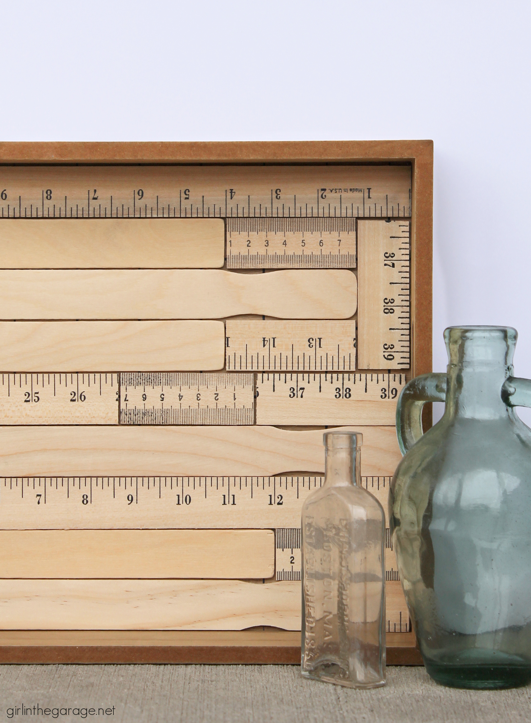 How to make an adorable upcycled wood tray with yardsticks and paint stirrers. Easy DIY home decor idea by Girl in the Garage