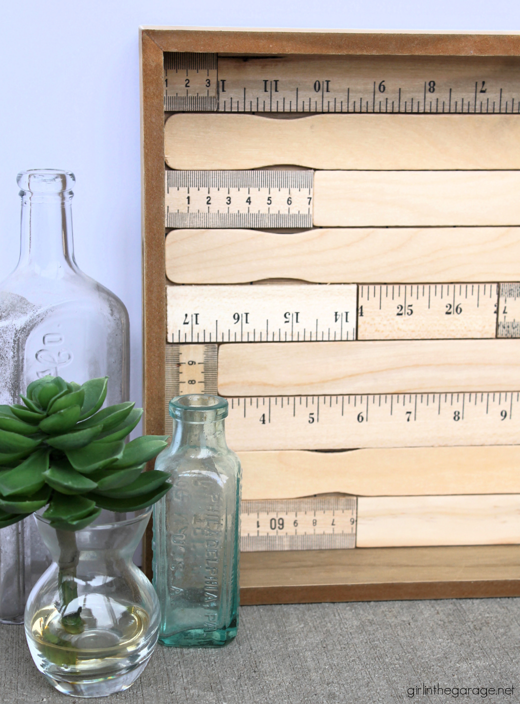 How to make an adorable upcycled wood tray with yardsticks and paint stirrers. Easy DIY home decor idea by Girl in the Garage