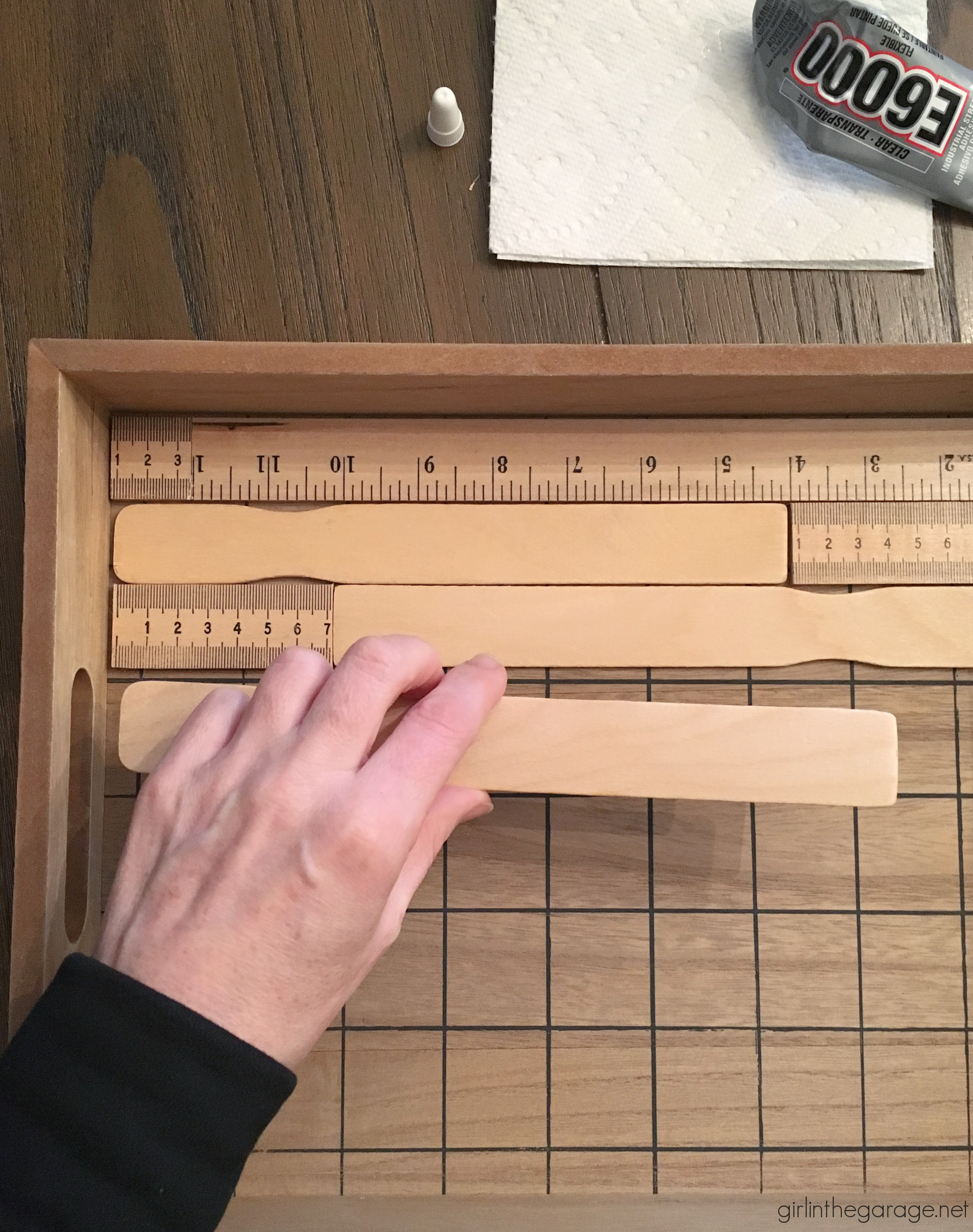 How to make an adorable upcycled wood tray with yardsticks and paint stirrers. Easy DIY home decor idea by Girl in the Garage