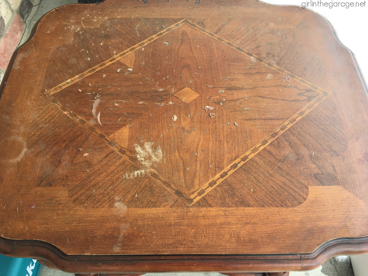 Sanded wood table with cuts and gouges. Furniture project by Girl in the Garage