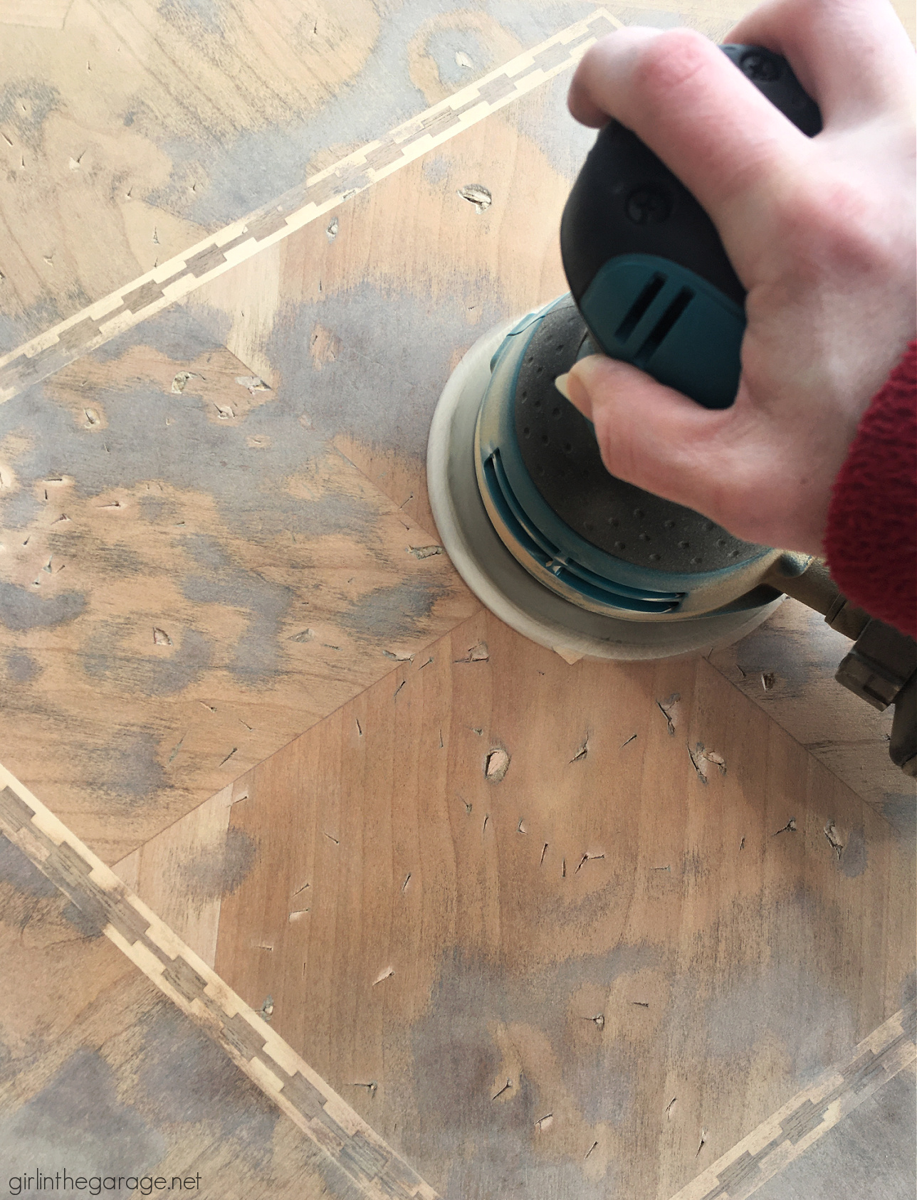 Sanded wood table with cuts and gouges. Furniture project by Girl in the Garage