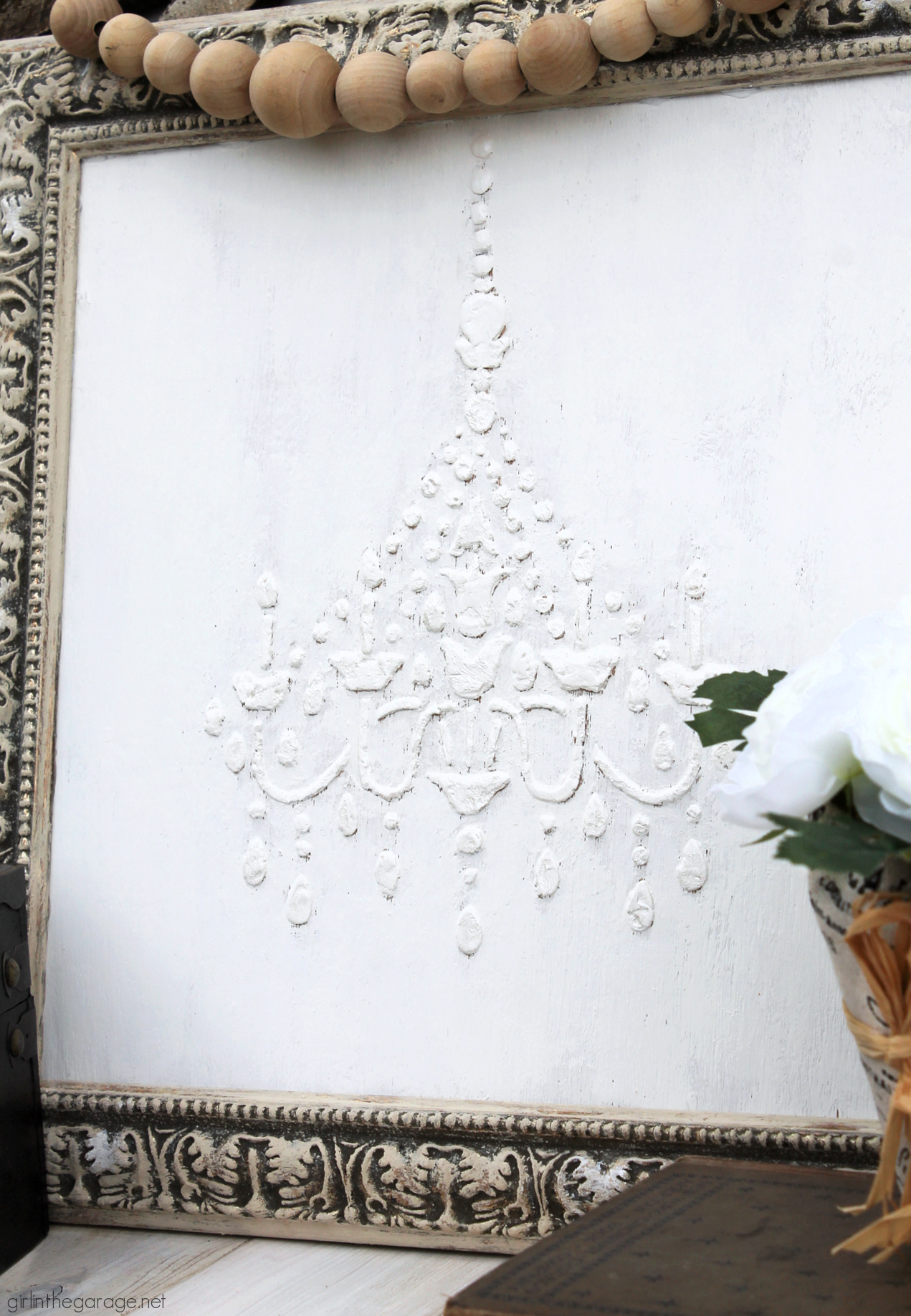 Learn how to make custom 3D chandelier wall art with a raised stencil technique and Chalk Paint. Beautiful French vintage decor by Girl in the Garage