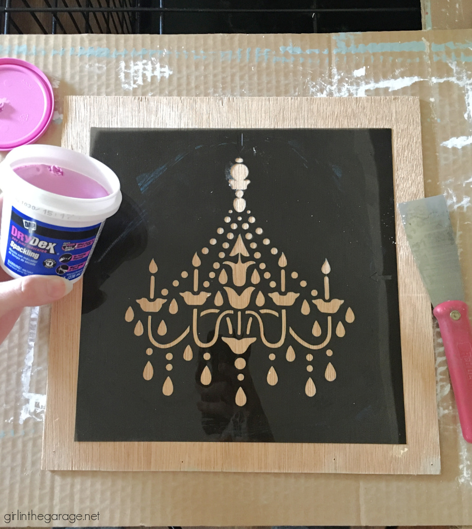 Learn how to make custom 3D chandelier wall art with a raised stencil technique and Chalk Paint. Beautiful French vintage decor by Girl in the Garage