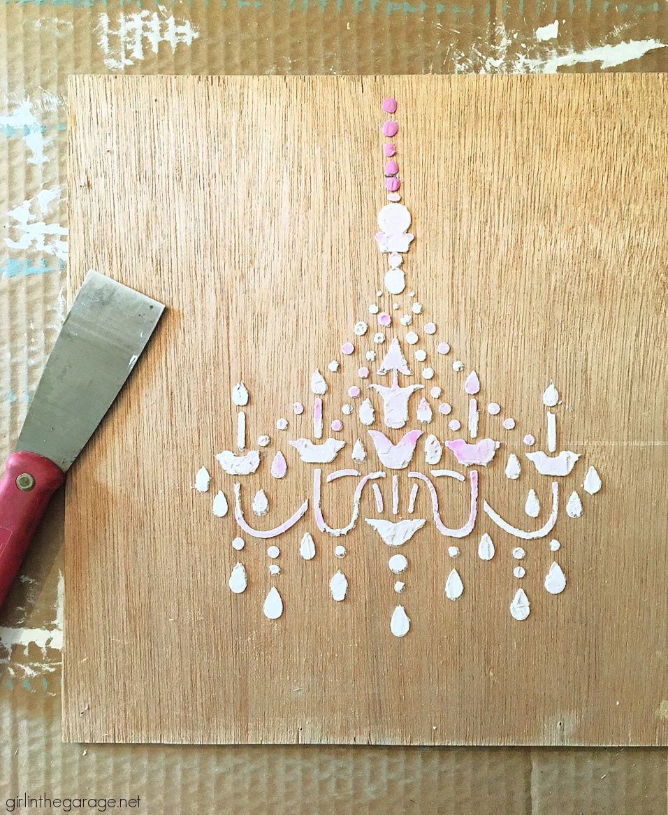 Learn how to make custom 3D chandelier wall art with a raised stencil technique and Chalk Paint. Beautiful French vintage decor by Girl in the Garage