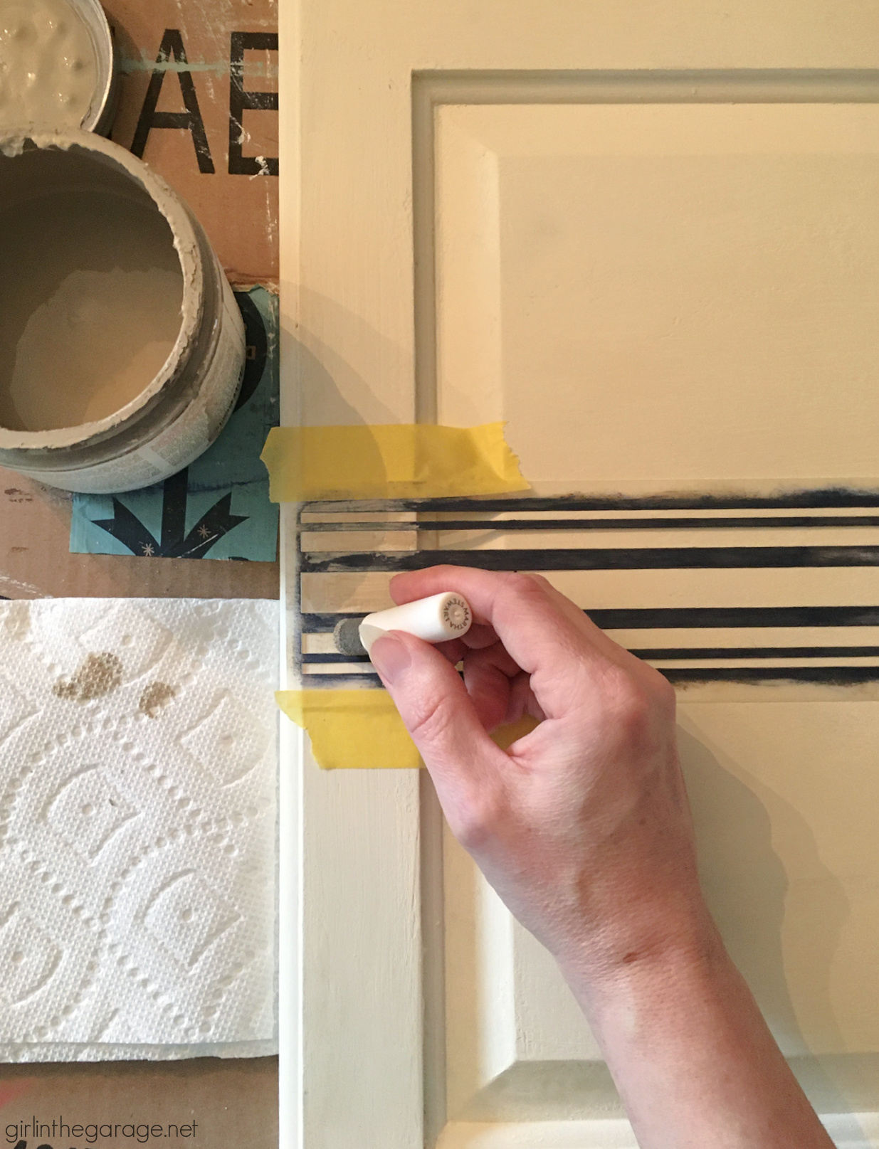 Learn how to repurpose an old cabinet door into an adorable DIY laundry room sign with grain sack stripes! By Girl in the Garage