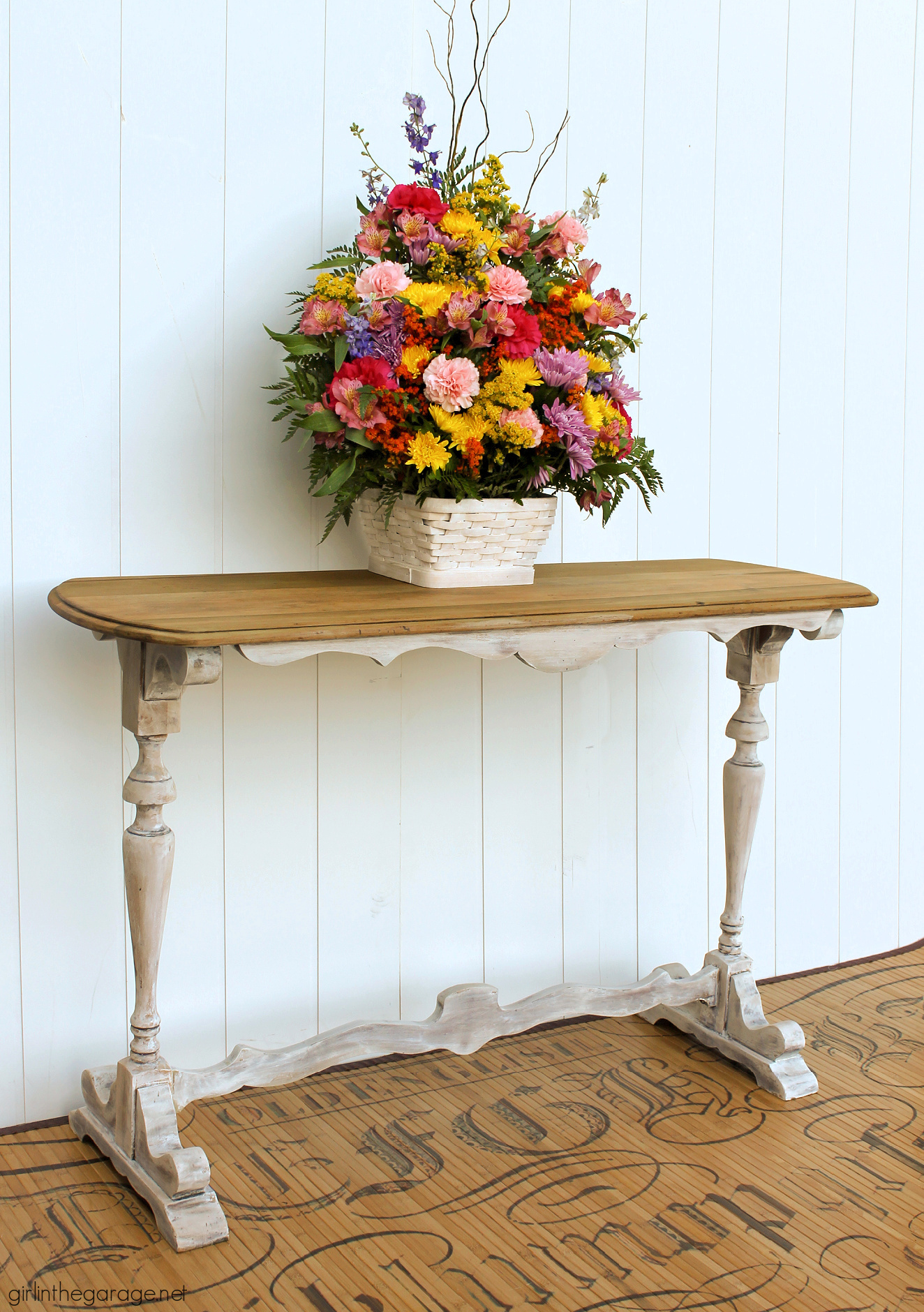 Learn how to create a DIY farmhouse sofa table with just a hint of whitewashed paint on bottom and a gorgeous natural wood top. DIY painted furniture and decor ideas by Girl in the Garage