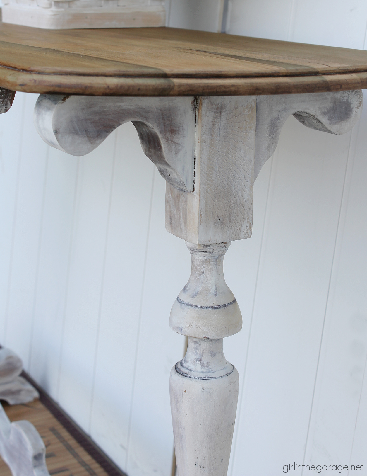 Learn how to create a DIY farmhouse sofa table with just a hint of whitewashed paint on bottom and a gorgeous natural wood top. DIY painted furniture and decor ideas by Girl in the Garage