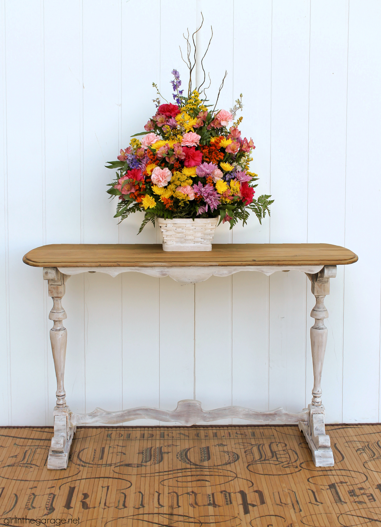 Learn how to create a DIY farmhouse sofa table with just a hint of whitewashed paint on bottom and a gorgeous natural wood top. DIY painted furniture and decor ideas by Girl in the Garage