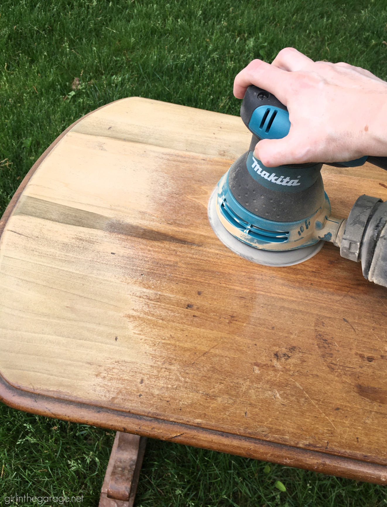 Makita random orbit sander on a wood sofa table - Girl in the Garage