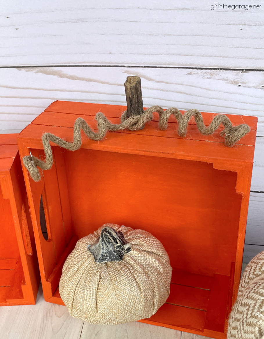 Learn how to make adorable painted crate pumpkins for easy DIY fall decor. Tutorial by Girl in the Garage