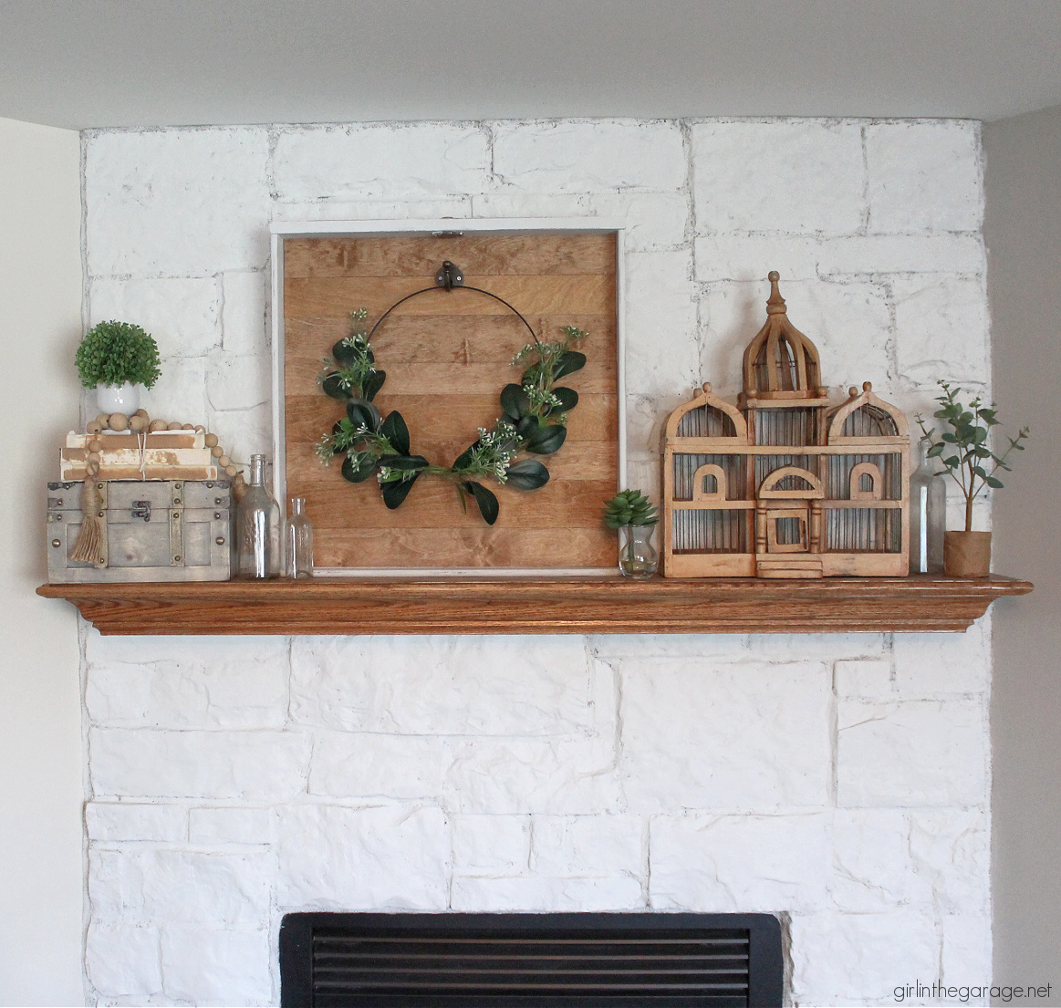 How to make a DIY wreath hanger from a repurposed drawer. Easily hang your wreaths on your mantel with this tutorial by Girl in the Garage