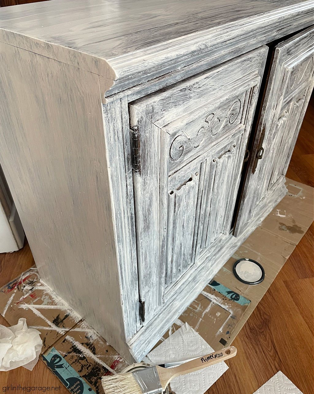 How to prime and paint a vintage wood cabinet with Rustoleum Chalked Paint in Soothing Blue. Step by step painted furniture tutorial by Girl in the Garage.