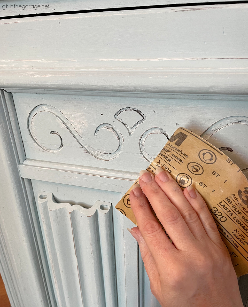 How to paint a vintage wood cabinet with Rustoleum Chalked Paint in Soothing Blue. Step by step painted furniture tutorial by Girl in the Garage.