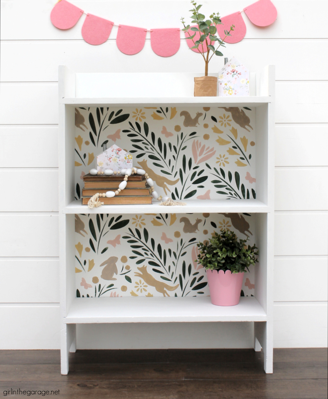 This hand painted bookcase features an adorable stencil and multiple paint colors. Girl in the Garage