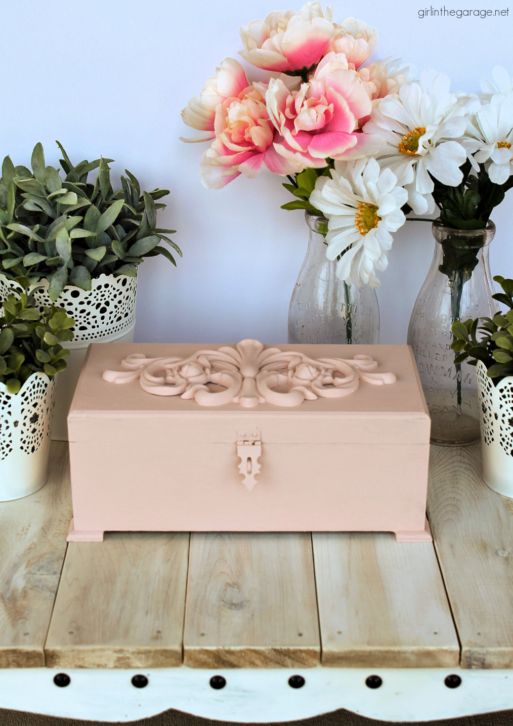 A cute pink hand painted wooden box with lid