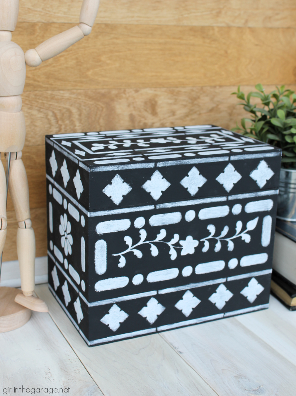 Learn how to stencil on wood decor and furniture. How to stencil bone inlay on a thrifted wood box. By Girl in the Garage