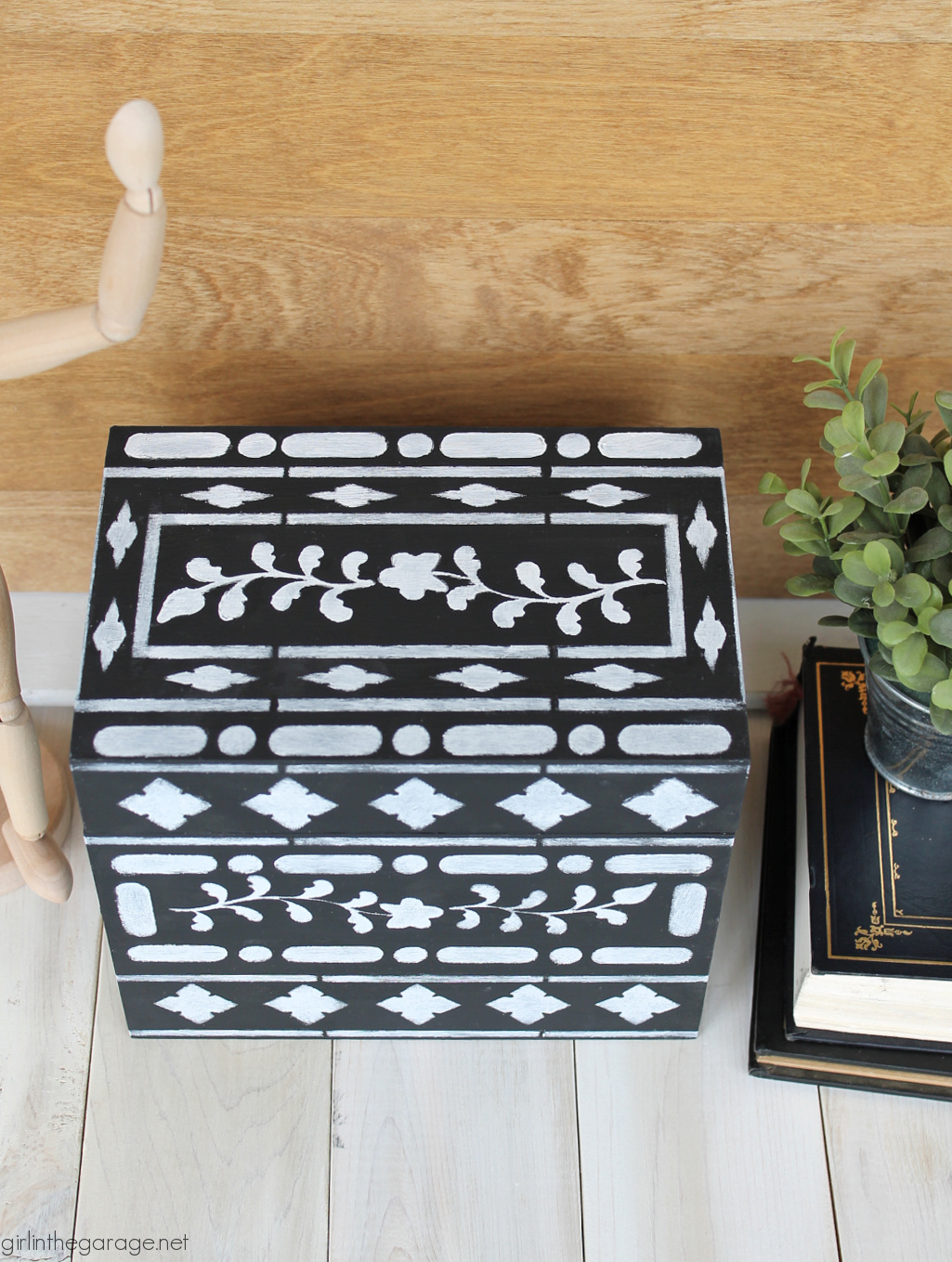 Learn how to stencil on wood decor and furniture. How to stencil bone inlay on a thrifted wood box. By Girl in the Garage