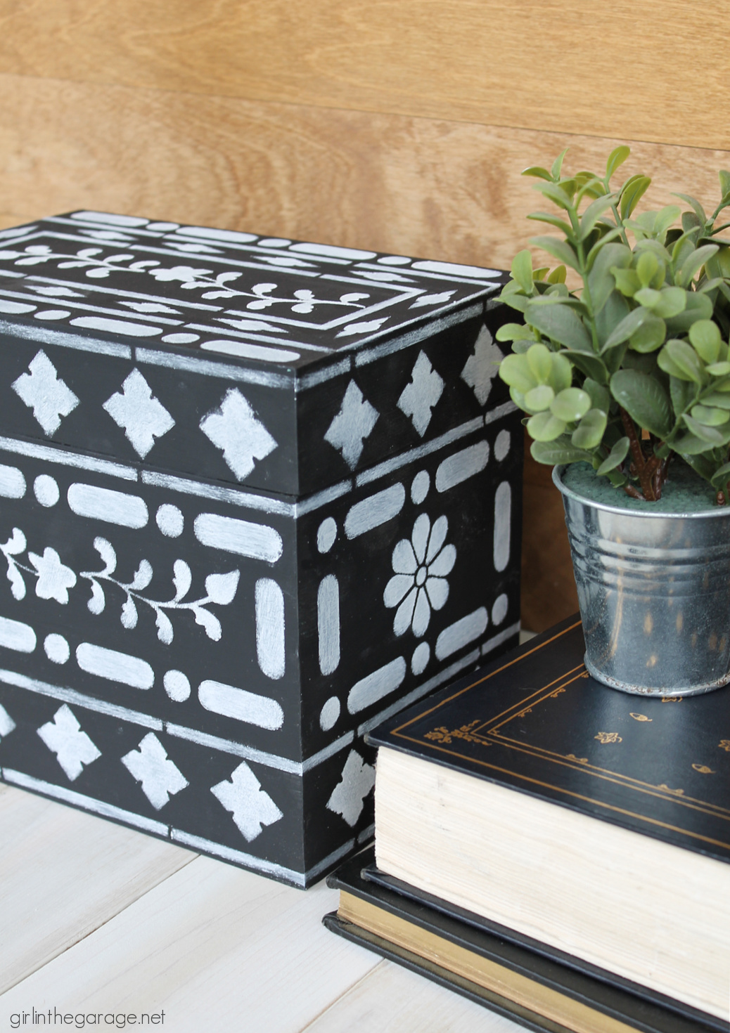 Learn how to stencil on wood decor and furniture. How to stencil bone inlay on a thrifted wood box. By Girl in the Garage